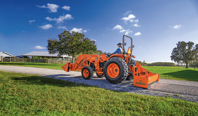 Compact Tractor Man using box blade to level out driveway