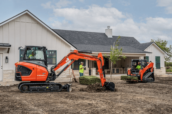 Construction equipment working outside of a house