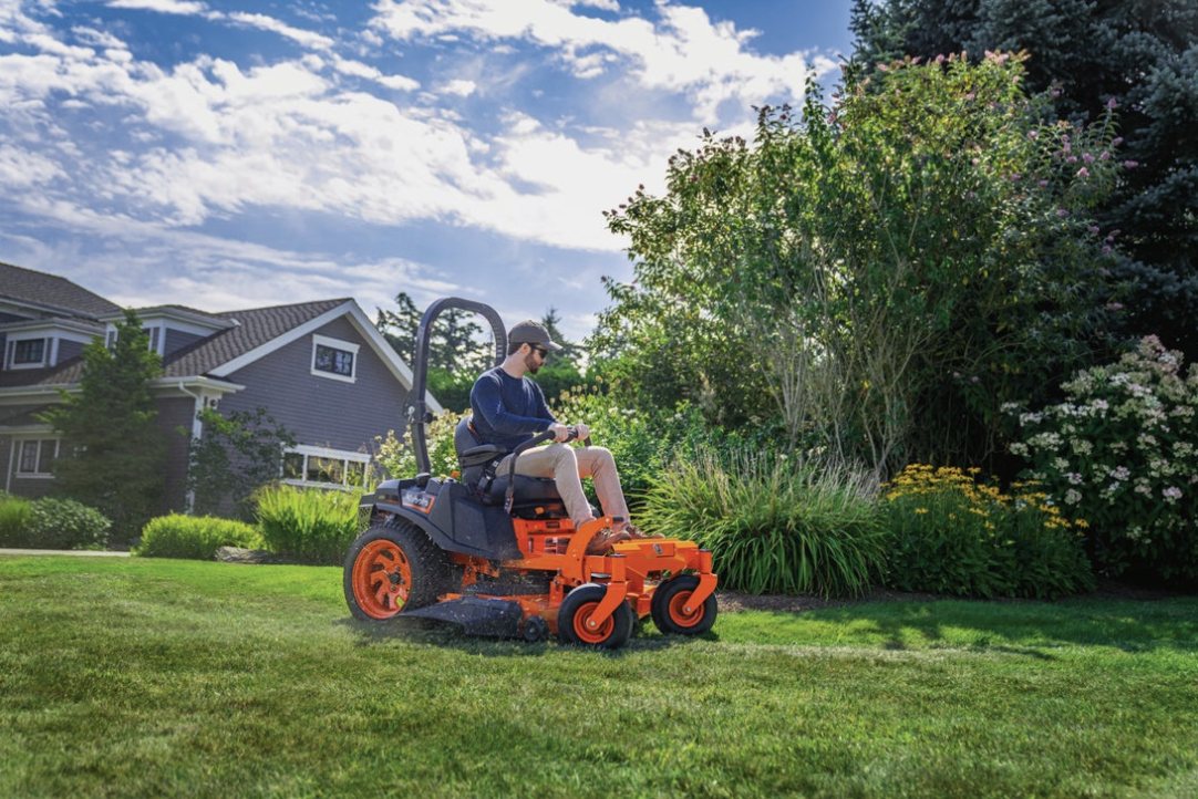 Kubota zero turn mower in front of house